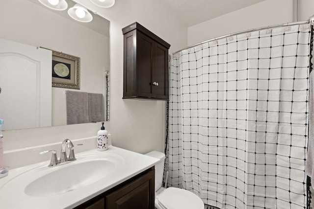 5910 Monte Rosa St, Santa Fe, NM 87507 - bathroom featuring toilet, vanity, and tiled shower