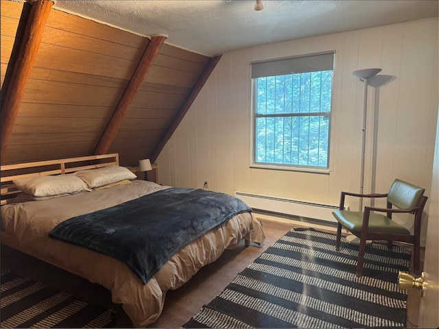7 W Meadow Ln, Sapello, NM 87745 - carpeted bedroom featuring a baseboard heating unit and lofted ceiling