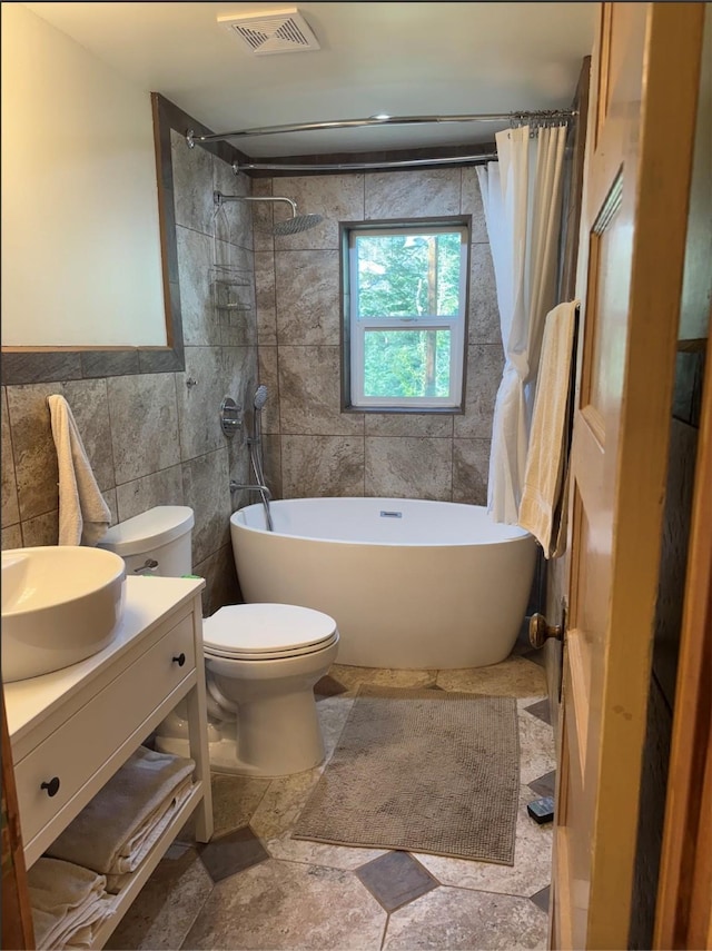 7 W Meadow Ln, Sapello, NM 87745 - full bathroom with tile walls, vanity, and shower / bath combo with shower curtain