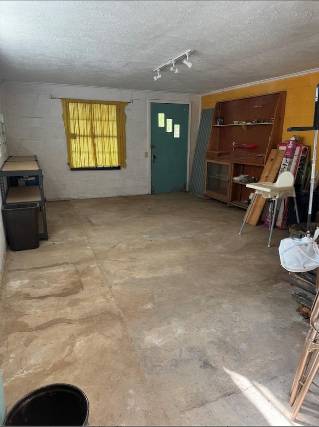 7 W Meadow Ln, Sapello, NM 87745 - garage with concrete block wall