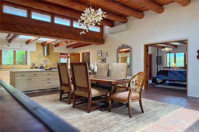 559 Camino Del Monte Sol, Santa Fe, NM 87505 - dining space with a wall unit AC, a chandelier, brick patterned flooring, and wooden ceiling with exposed beams