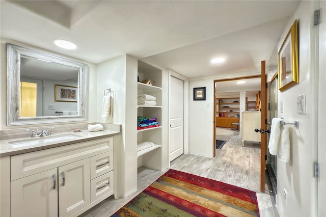 559 Camino Del Monte Sol, Santa Fe, NM 87505 - bathroom with wood finished floors and vanity