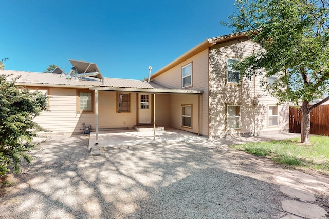 1765 38th St, Los Alamos, NM 87544 - rear view of property featuring metal roof and a patio