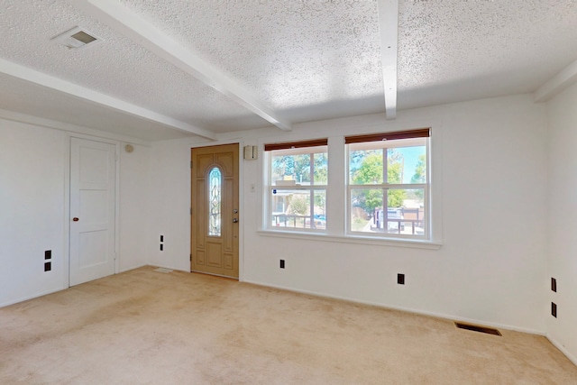 1765 38th St, Los Alamos, NM 87544 - entryway featuring beamed ceiling, light colored carpet, a textured ceiling, and baseboards