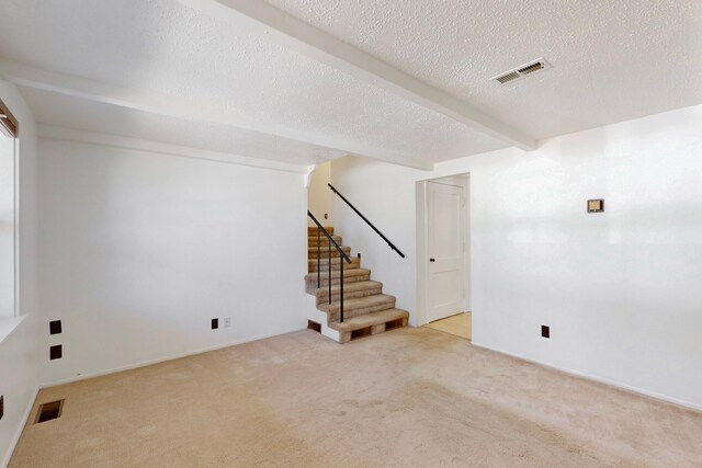 1765 38th St, Los Alamos, NM 87544 - finished below grade area featuring carpet, stairs, and a textured ceiling