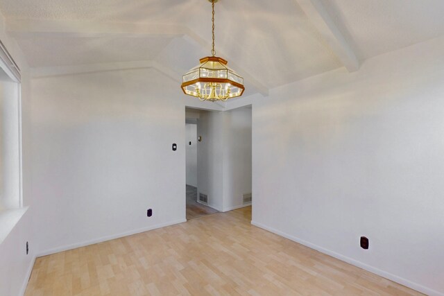 1765 38th St, Los Alamos, NM 87544 - empty room featuring a chandelier, light wood-style flooring, and baseboards