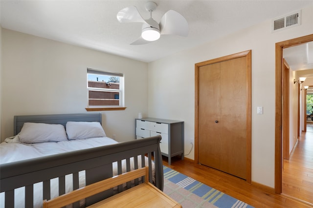 1208 Declovina St, Santa Fe, NM 87505 - bedroom featuring multiple windows, light wood-style flooring, and baseboards
