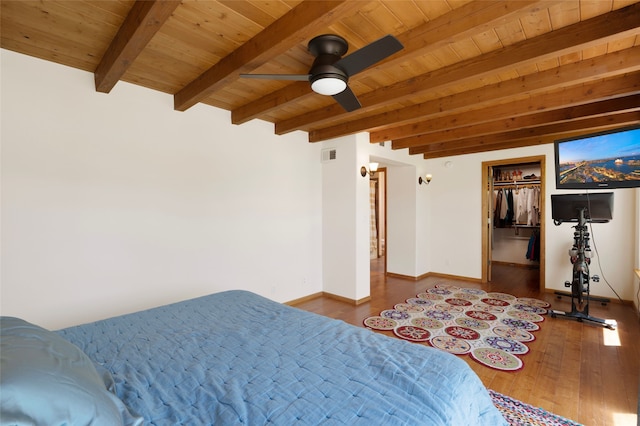 1208 Declovina St, Santa Fe, NM 87505 - bedroom with wooden ceiling with exposed beams, wood finished floors, baseboards, a ceiling fan, and a spacious closet
