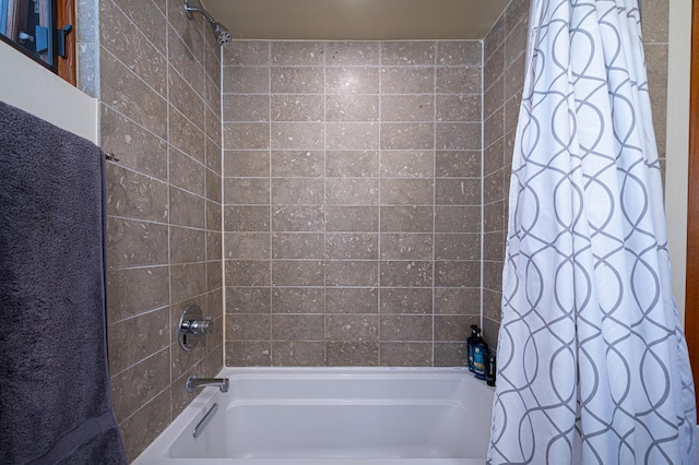 543 Juanita Unit B, Santa Fe, NM 87501 - bathroom featuring shower / bath combo with shower curtain