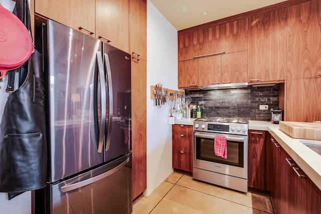 543 Juanita Unit B, Santa Fe, NM 87501 - kitchen featuring stainless steel appliances, modern cabinets, backsplash, light countertops, and light tile patterned flooring