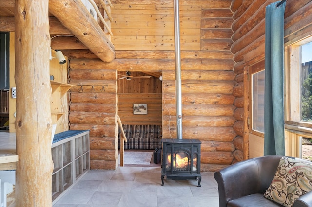 208A Camino Los Abuelos, Santa Fe, NM 87508 - living area with a wood stove and log walls