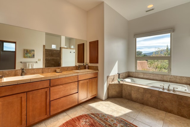 301 Camino De Las Huertas, Placitas, NM 87043 - bathroom with a garden tub, double vanity, tile patterned floors, and tiled shower