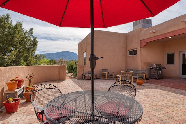 301 Camino De Las Huertas, Placitas, NM 87043 - view of patio with outdoor dining area, a mountain view, and grilling area