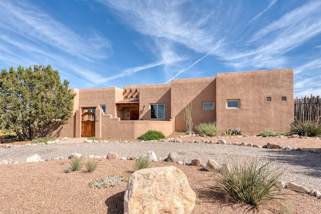 301 Camino De Las Huertas, Placitas, NM 87043 - pueblo revival-style home featuring stucco siding