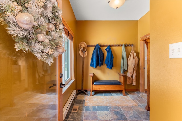 50 Jackson Hole Rd, Angel Fire, NM 87710 - mudroom with baseboard heating, stone finish flooring, and baseboards