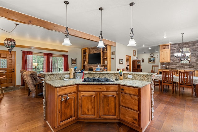 50 Jackson Hole Rd, Angel Fire, NM 87710 - kitchen with gas cooktop, backsplash, dark wood-type flooring, open floor plan, and pendant lighting