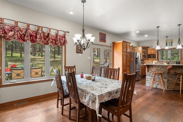 50 Jackson Hole Rd, Angel Fire, NM 87710 - dining area featuring dark wood-style flooring, french doors, a chandelier, baseboards, and recessed lighting