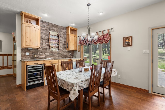 50 Jackson Hole Rd, Angel Fire, NM 87710 - dining area featuring wine cooler, baseboards, a chandelier, dark wood-style floors, and recessed lighting