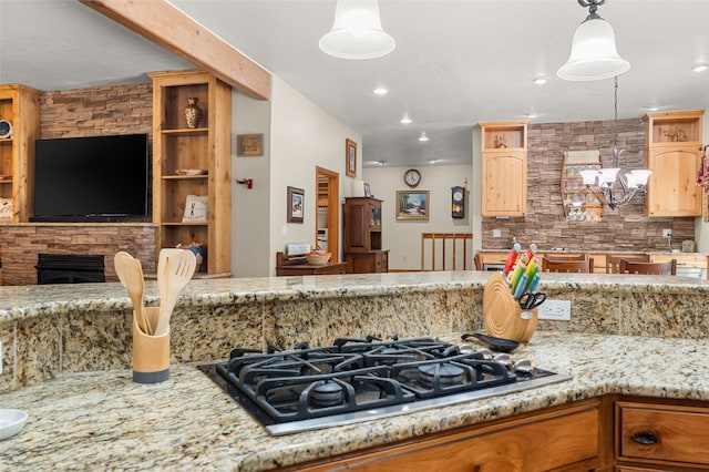 50 Jackson Hole Rd, Angel Fire, NM 87710 - kitchen with gas stovetop, backsplash, light stone counters, recessed lighting, and pendant lighting