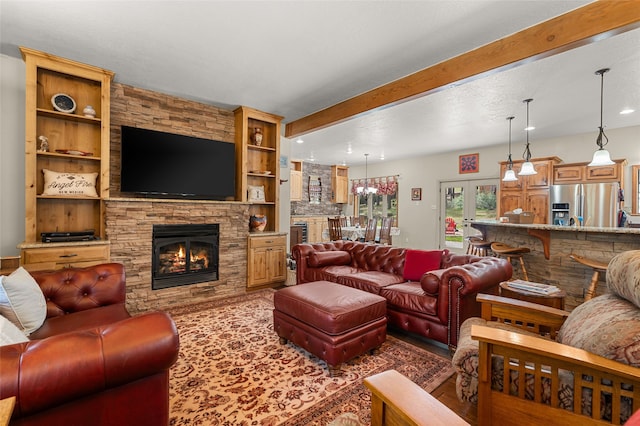 50 Jackson Hole Rd, Angel Fire, NM 87710 - living area featuring a stone fireplace, beamed ceiling, and recessed lighting