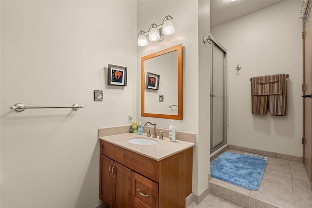 50 Jackson Hole Rd, Angel Fire, NM 87710 - bathroom with vanity, a stall shower, tile patterned flooring, and baseboards