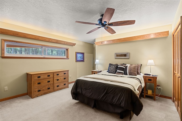 50 Jackson Hole Rd, Angel Fire, NM 87710 - bedroom featuring carpet, baseboards, ceiling fan, and a textured ceiling