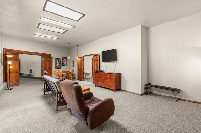 50 Jackson Hole Rd, Angel Fire, NM 87710 - living area with light carpet, a textured ceiling, and baseboards