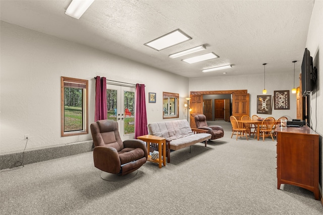 50 Jackson Hole Rd, Angel Fire, NM 87710 - carpeted living area with a textured ceiling and french doors