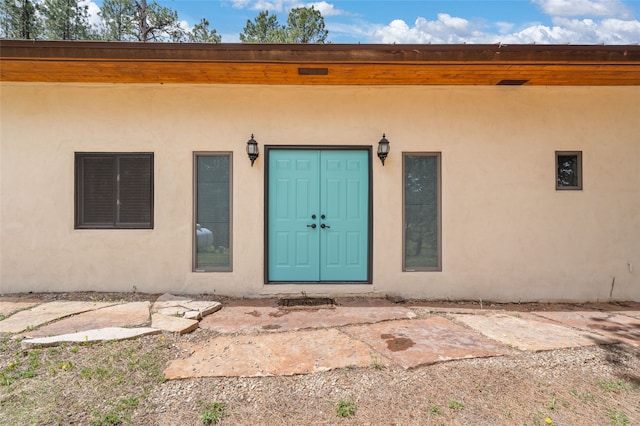 50 Jackson Hole Rd, Angel Fire, NM 87710 - view of exterior entry with stucco siding