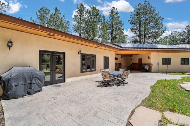 50 Jackson Hole Rd, Angel Fire, NM 87710 - view of patio with french doors, grilling area, and outdoor dining area