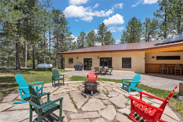 50 Jackson Hole Rd, Angel Fire, NM 87710 - view of patio featuring an outdoor fire pit and french doors