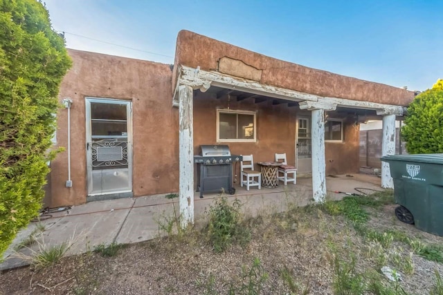1619 Brae St, Santa Fe, NM 87505 - back of property with a patio and cooling unit