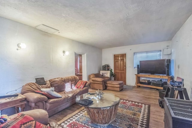 1619 Brae St, Santa Fe, NM 87505 - living room featuring wood finished floors and a textured ceiling