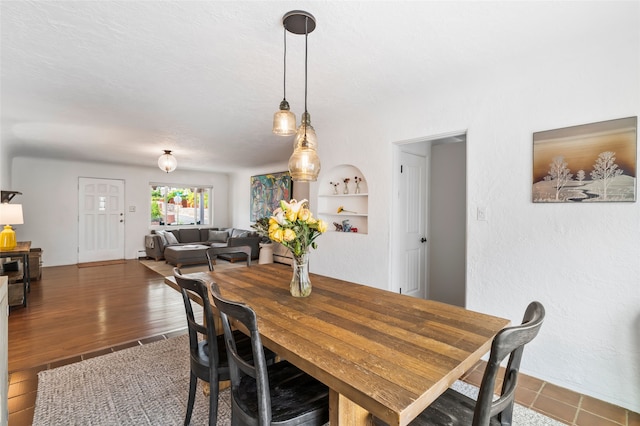 309 Lomita St, Santa Fe, NM 87505 - dining space featuring a baseboard radiator