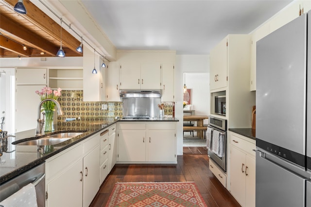 309 Lomita St, Santa Fe, NM 87505 - kitchen featuring appliances with stainless steel finishes, a sink, dark wood-style flooring, dark stone counters, and backsplash