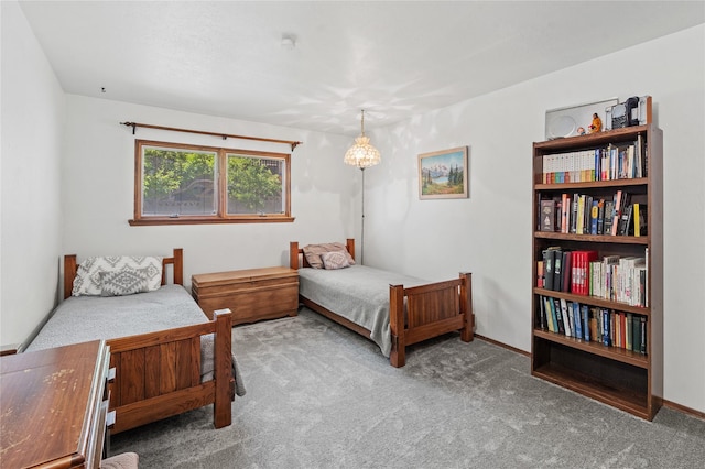 1905 Camino Redondo, Los Alamos, NM 87544 - carpeted bedroom with baseboards and a chandelier