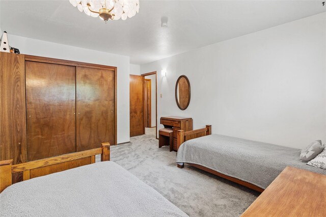 1905 Camino Redondo, Los Alamos, NM 87544 - bedroom featuring carpet flooring, a chandelier, and a closet