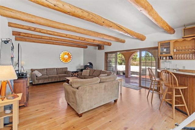 1905 Camino Redondo, Los Alamos, NM 87544 - living room featuring bar with sink, light wood-style floors, and beam ceiling