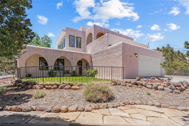 1905 Camino Redondo, Los Alamos, NM 87544 - southwest-style home with a garage, stucco siding, and driveway