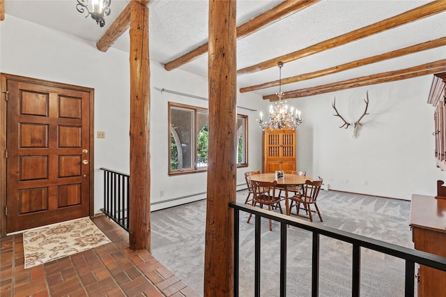 1905 Camino Redondo, Los Alamos, NM 87544 - foyer with a chandelier, a baseboard heating unit, beam ceiling, brick patterned floors, and dark carpet