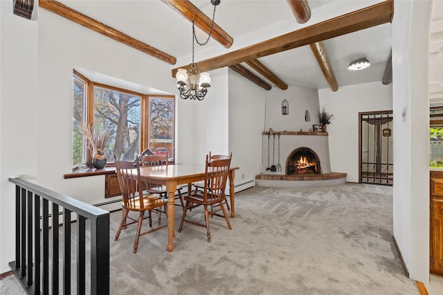 1905 Camino Redondo, Los Alamos, NM 87544 - carpeted dining space with beamed ceiling, a brick fireplace, and a chandelier