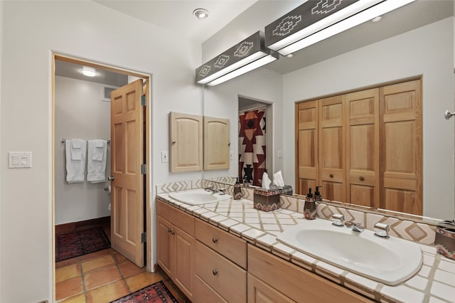 3101 Old Pecos Trl Unit 101, Santa Fe, NM 87505 - full bath featuring double vanity and tile patterned flooring