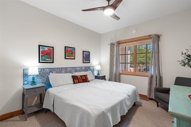 3101 Old Pecos Trl Unit 101, Santa Fe, NM 87505 - carpeted bedroom with baseboards and ceiling fan