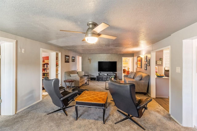 133 County Rd 135, Hernandez, NM 87537 - living room featuring light colored carpet, a ceiling fan, a textured ceiling, and baseboards