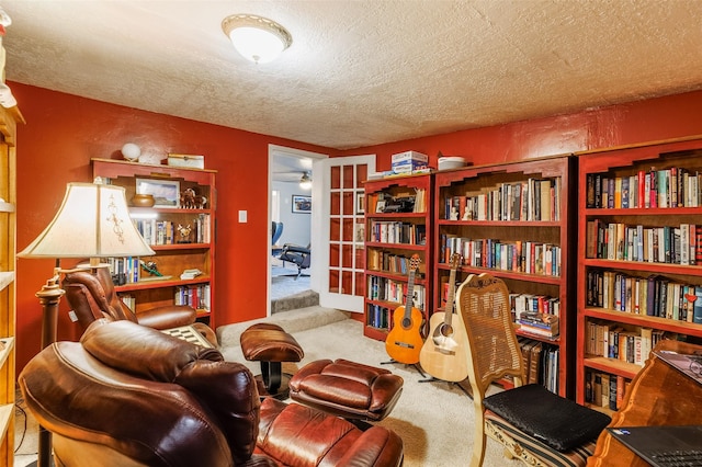 133 County Rd 135, Hernandez, NM 87537 - sitting room with carpet floors, a textured ceiling, and ceiling fan