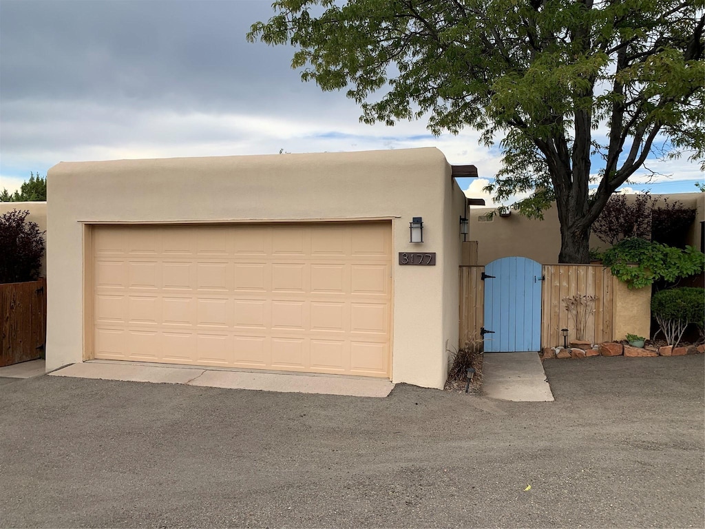 3177 Plaza Blanca, Santa Fe, NM 87507 - garage with a gate