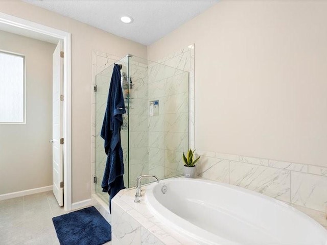 5220 Gold Hill Ln, Santa Fe, NM 87507 - full bath with a garden tub, a shower stall, recessed lighting, and baseboards