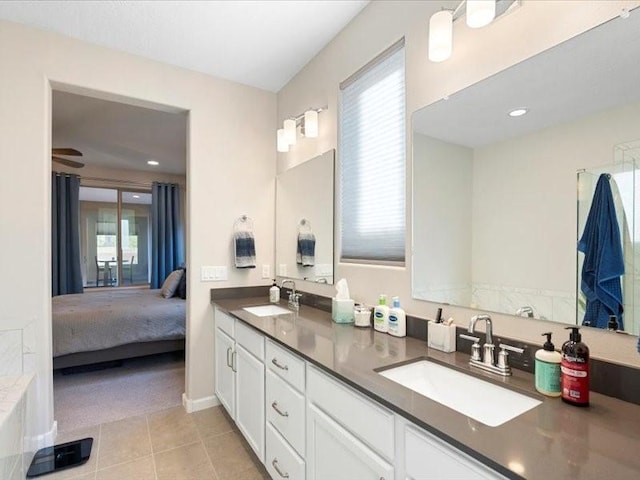 5220 Gold Hill Ln, Santa Fe, NM 87507 - ensuite bathroom with double vanity, tile patterned flooring, and recessed lighting