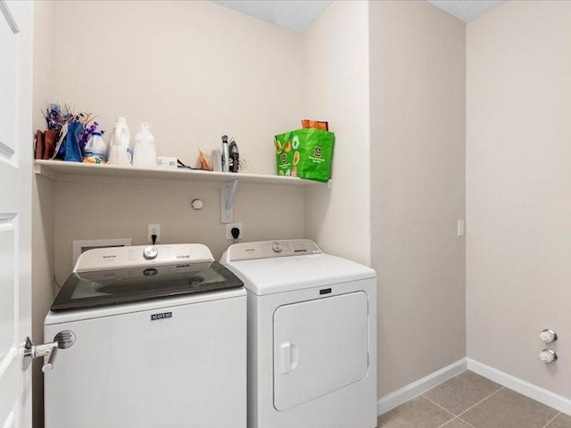 5220 Gold Hill Ln, Santa Fe, NM 87507 - laundry area featuring washing machine and clothes dryer, baseboards, and light tile patterned floors