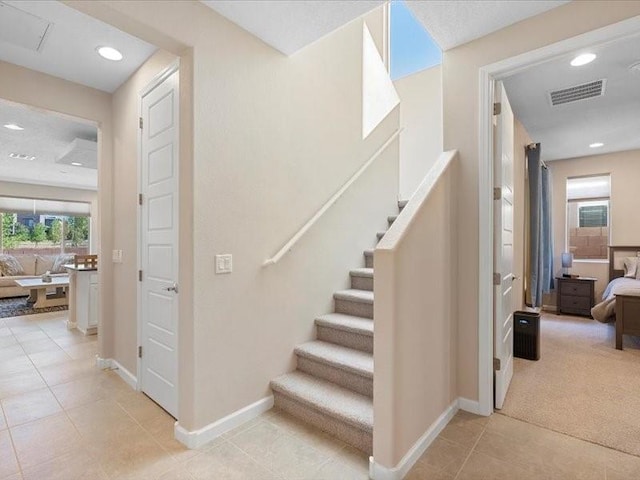 5220 Gold Hill Ln, Santa Fe, NM 87507 - stairs featuring tile patterned floors, baseboards, and recessed lighting